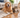 Golden retriever and tabby cat beside shed pet hair on a hardwood floor and living-room rug