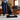 Person vacuuming a white rug with the Kirby V530
